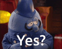 a blue puppet with a hat and mustache is asking the question yes