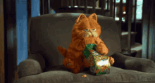 Garfield Eating GIF - Garfield Eating Goldfish GIFs