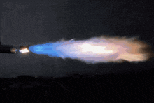 a blue and white flame is coming out of a lighter