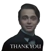 a man wearing a tuxedo and bow tie says thank you