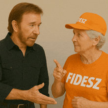 a man and woman are talking and the woman is wearing a shirt that says fidesz