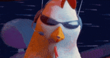 a cartoon chicken wearing sunglasses and headphones is looking at the camera .
