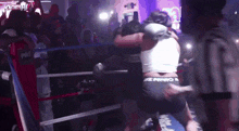 a woman in a boxing ring with the word pro on the side