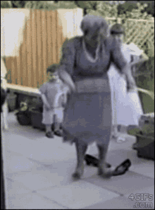 old woman dancing hula hoop jump