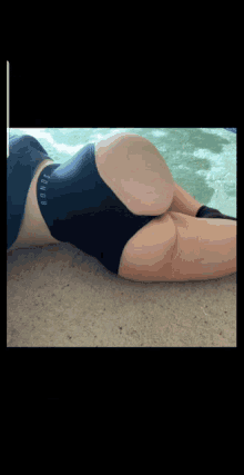 a woman is laying on the floor wearing black underwear that says bondi