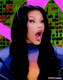 a close up of a woman with her mouth wide open