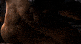 a close up of a person 's chest with a lightning bolt coming out of it