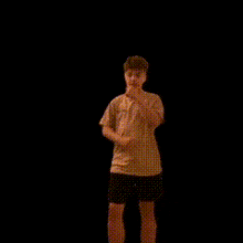 a man with his arms crossed is standing in front of a black background with the words " this guy is into something " above him