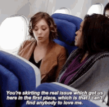 two women sitting on an airplane with a caption that says you 're skirting the real issue which got us here