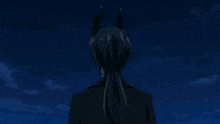 a man in a suit and tie with horns on his head is standing in front of a night sky .