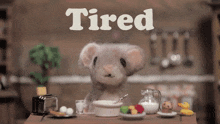 a stuffed mouse sits at a table with a bowl of cereal and the word tired above it
