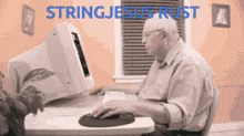 an older man sits at a desk using a computer with stringjesus rust written in blue
