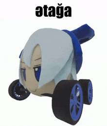 a stuffed toy with wheels and the word ata on the bottom