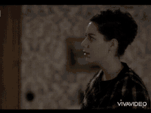 a woman 's face is shown in a video with the word vivavideo at the bottom