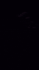 a hand is holding a glowing object with a circle around it