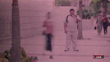 a blurry picture of people walking down a street with the word full in red
