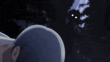 a person is looking at a dark figure with glowing eyes in the dark