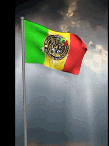 a green yellow and red flag that says " one love "