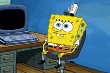 a cartoon of spongebob sitting in front of a computer desk