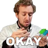 a man with a beard is holding a bottle and says okay