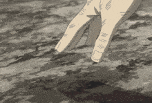 a close up of a person 's hand with the thumb pointing to the ground