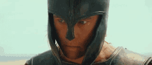 a close up of a man wearing a helmet and armor