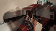 a man sits in a diner booth using a laptop computer