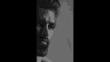 a black and white photo of a man with a beard and the words sri 's online .