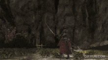 a gif from gifrun.com shows a person holding a sword and shield
