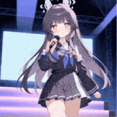 a girl with long hair is singing into a mic