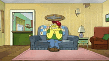 a cartoon of a man sitting on a couch with a shark on the wall above him