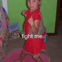 a little girl in a red dress is upside down with the words fight me written on the bottom
