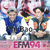two men are sitting in front of a colorful poster that says phi bao