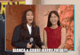 two women standing next to each other with the words bianca and gabbi happy pride