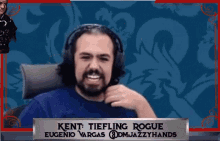 a man wearing headphones and a name tag that says kent tiefling rogue eugenio vargas @dmjazzyhands