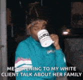a man is drinking a cup of coffee while talking to his white client about her family .