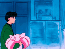 a man in a green jacket is standing next to a girl in pink hair