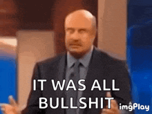 a man in a suit and tie is saying it was all bullshit .