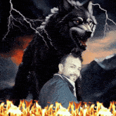 a man stands in front of a painting of a wolf and fire
