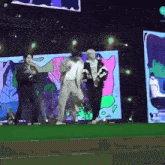 a group of people are dancing on a stage