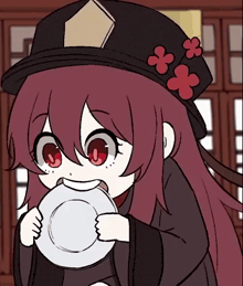 a girl with red hair is holding a plate in her mouth