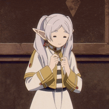 a girl with white hair and elf ears is standing in front of a wall with her eyes closed