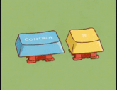 a person is pressing a blue key next to a yellow key that says r.