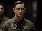 a man in a military uniform has a patch on his jacket that says bob