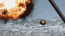 a bullet is flying through the air in front of a huge explosion