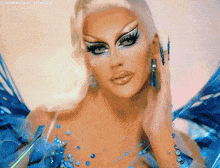 a close up of a drag queen 's face with @vonxodd tumblr at the bottom of the image