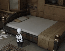 a person standing in front of a bed that has a white mattress