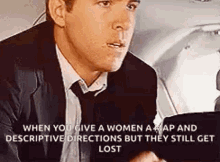 a man in a suit and tie is sitting in a car talking to a woman .