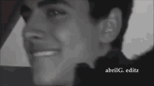 a black and white photo of a man 's face with the name abrilg.editz written below it .
