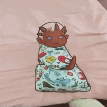 a drawing of a baby wrapped in a blanket with a cartoon character on it